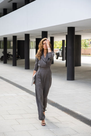 Woman wearing grey well-fitted jumpsuit