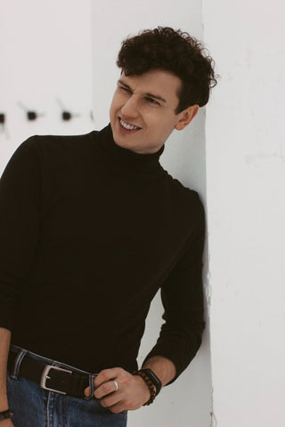 Close photo of a man in a black turtleneck