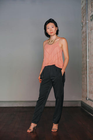 a flowy blouse and straight-leg pants