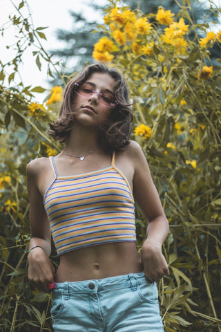 Woman in a multicolored striped crop top