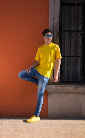 Man denim jeans sunglasses yellow t-shirt