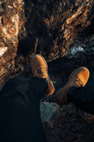 Photo of men's feet with hiking boots