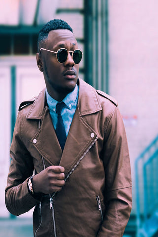 husband dressing woman leather jacket