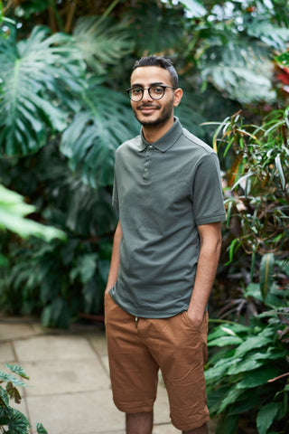 Man in a saje green polo shirt