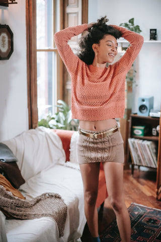 gray skirt outfit pink sweater belt