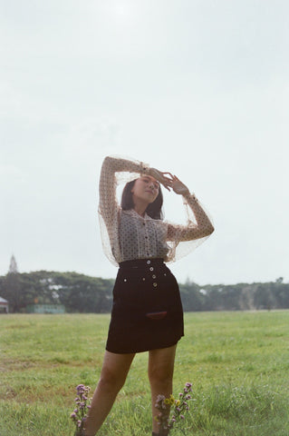 sheer blouse over a corset