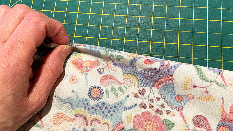 smooth the edges of the pillowcase seams