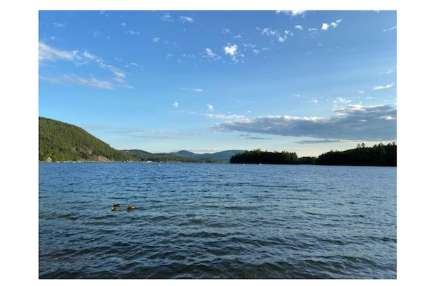 Open water with mountains in the background.