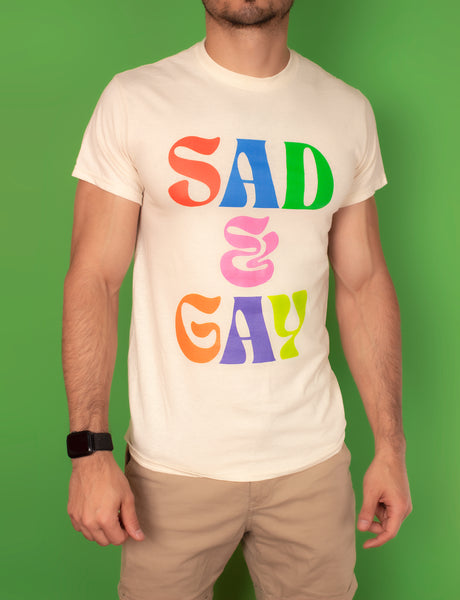 T-shirt that says Sad & Gay in rainbow colors