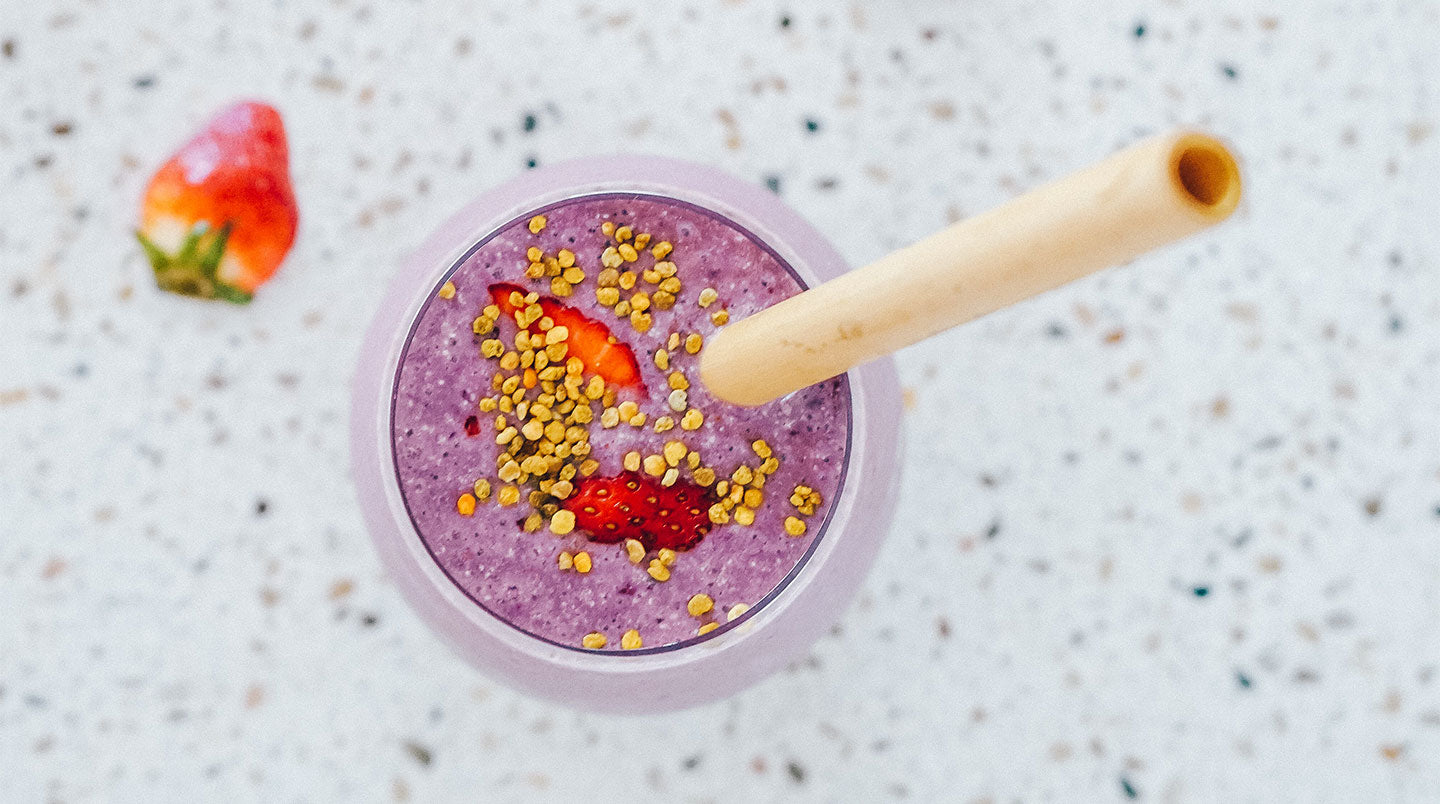 Glass of chocolate and berry post workout smoothie.