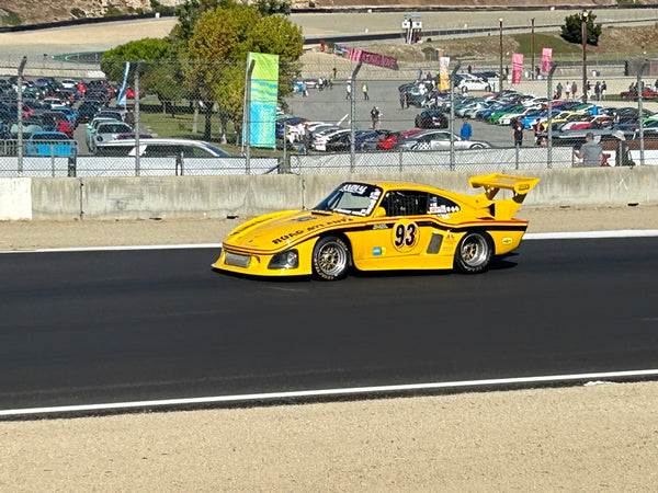 The yellow 1976 Porsche 935 K3 n° 93 on track at Laguna Seca during Rennsport Reunion 7