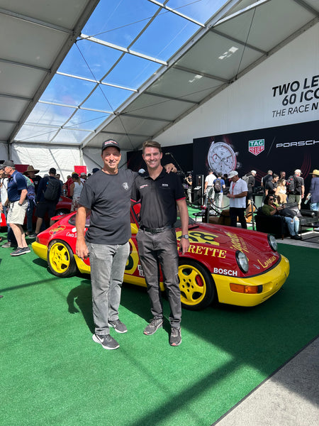 Joe Anselmo with his son in front of a Porsche 911 Carrera Cup of Kerry Morse & Ed Palmer at Rennsport Reunion 7