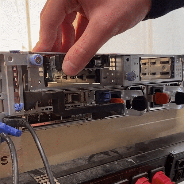 GIF of someone installing 4 hard drives into the rear flexbay of an R740xd