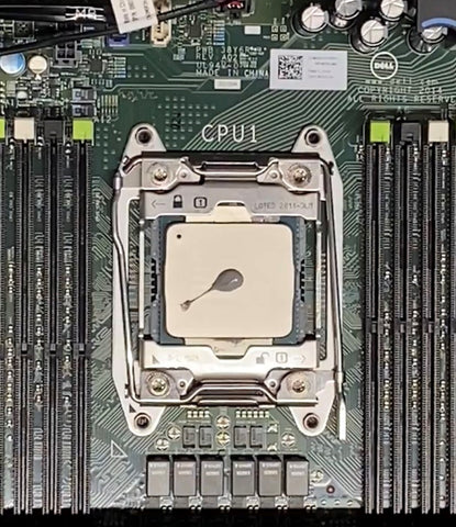 Pea-sized amount of thermal paste in center of processor.