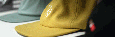 Line of baseball caps blurred