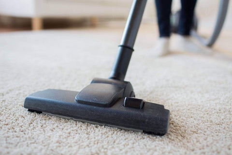 Vacuuming carpet