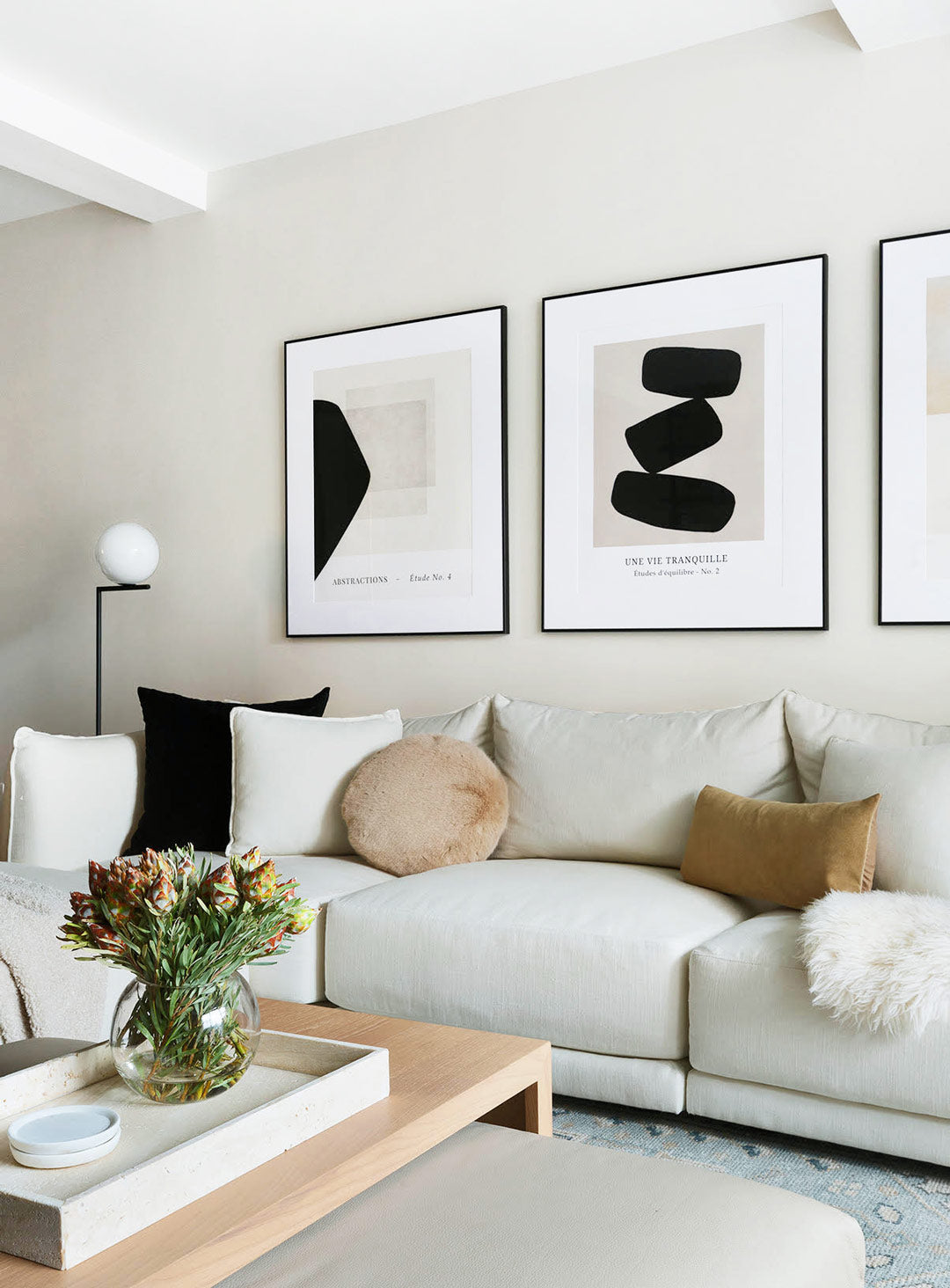 The neutral color palette in this modern family living room is Clare’s light beige interior wall paint named Classic.