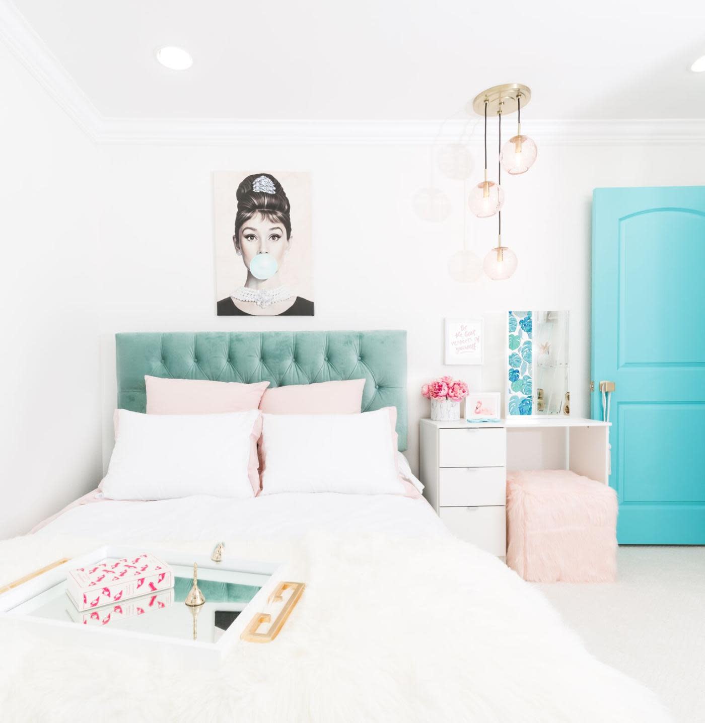 This teen's bedroom re-do was designed to last! Thanks to a classic white color palette, accessories can be changed out over the years to keep the room fresh.