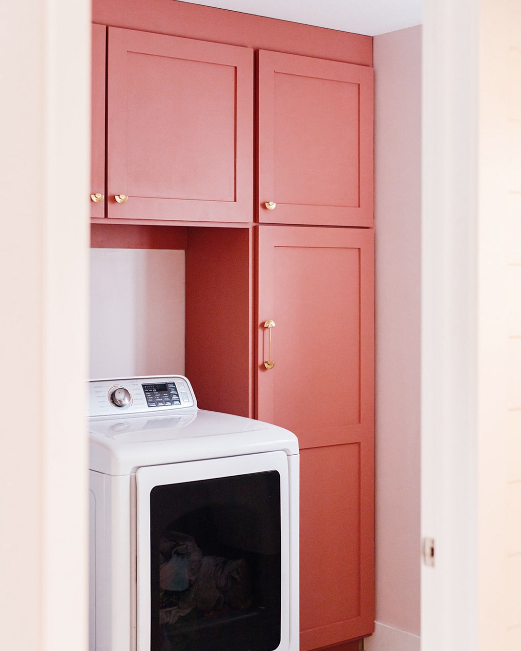 Creative paint ideas to inspire your next paint project. Try a vibrant color for your laundry room cabinets like these painted in Pink Sky.