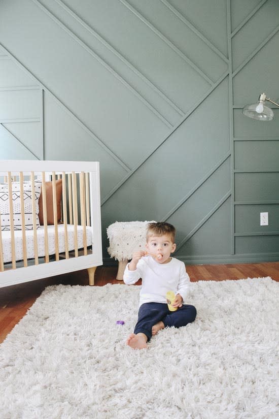 A green accent wall. This accent wall idea is perfect for a kids room. Green wall paint color is Current Mood by Clare Paint