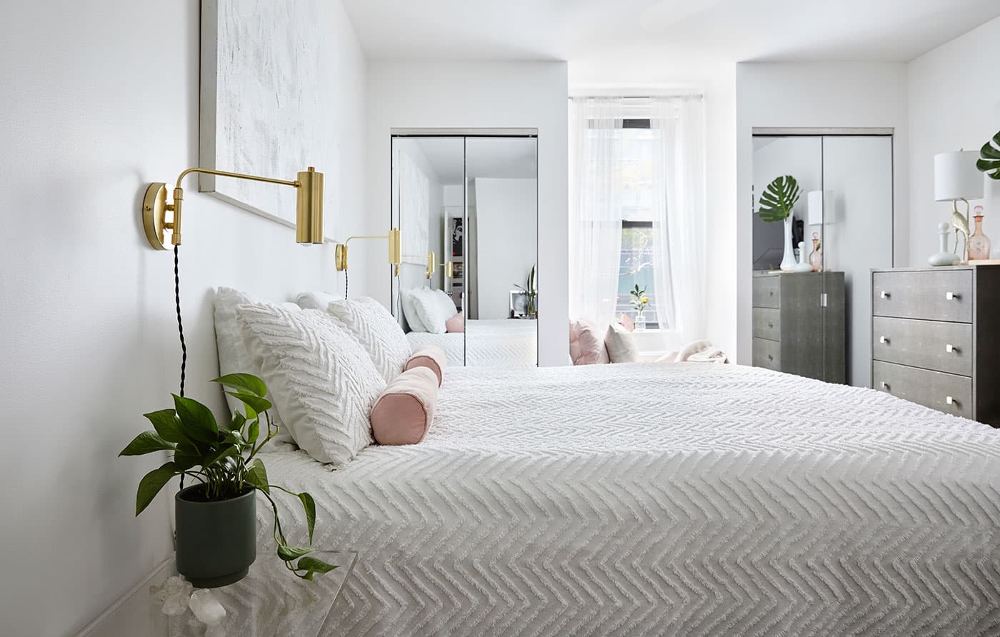 This stylish all-white bedroom makeover combines little luxuries and minimalist decor to create the ultimate bedroom retreat. See inside this dreamy space.