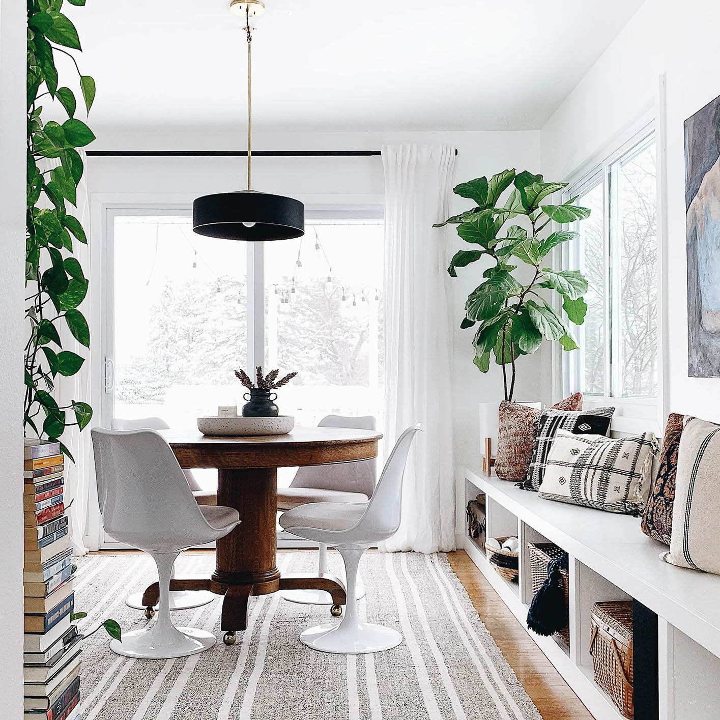 A bold door pained in Blackest by Clare is the perfect contrast for all-white walls. This stunning home is a lesson in how to make shades of white paint work in every room in your home.