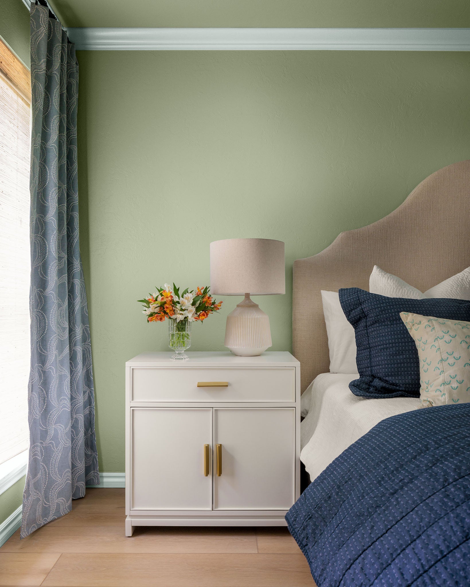 Step into this bedroom makeover by Clare Collective ambassador Ashley Whiteside. Grayish, a gray with green paint color, and Money Moves, the perfect sage green paint color, create a calming bedroom oasis. Read more on the blog at clare.com