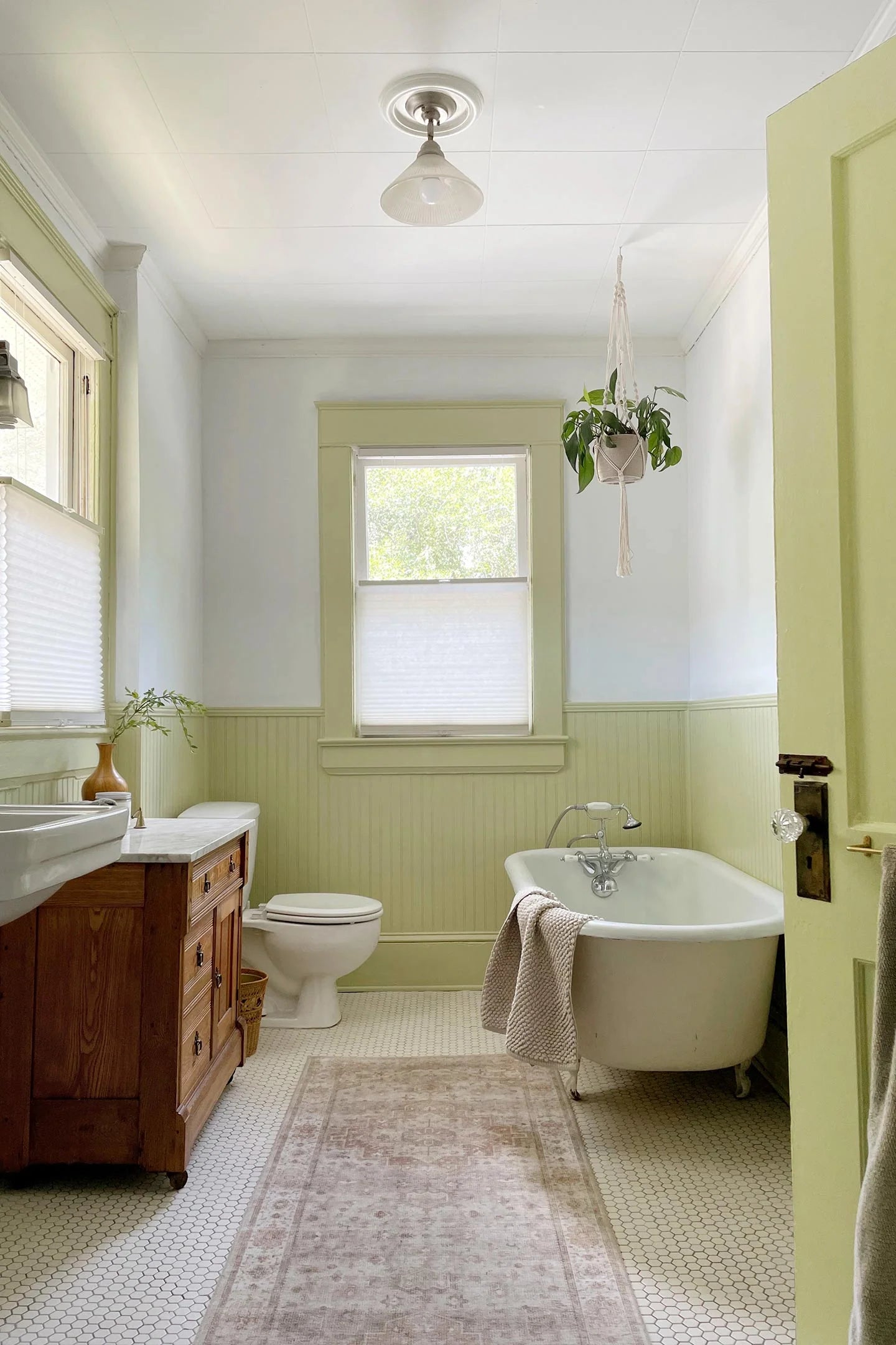 Bathroom featuring High Vibe, a green paint color by Clare