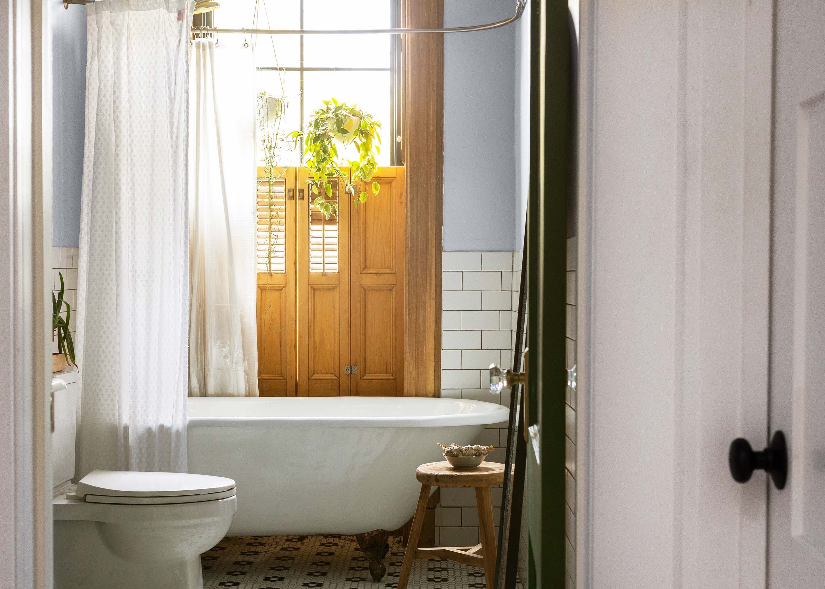 Old-school touches and a fun color for this bathroom make it memorable space.