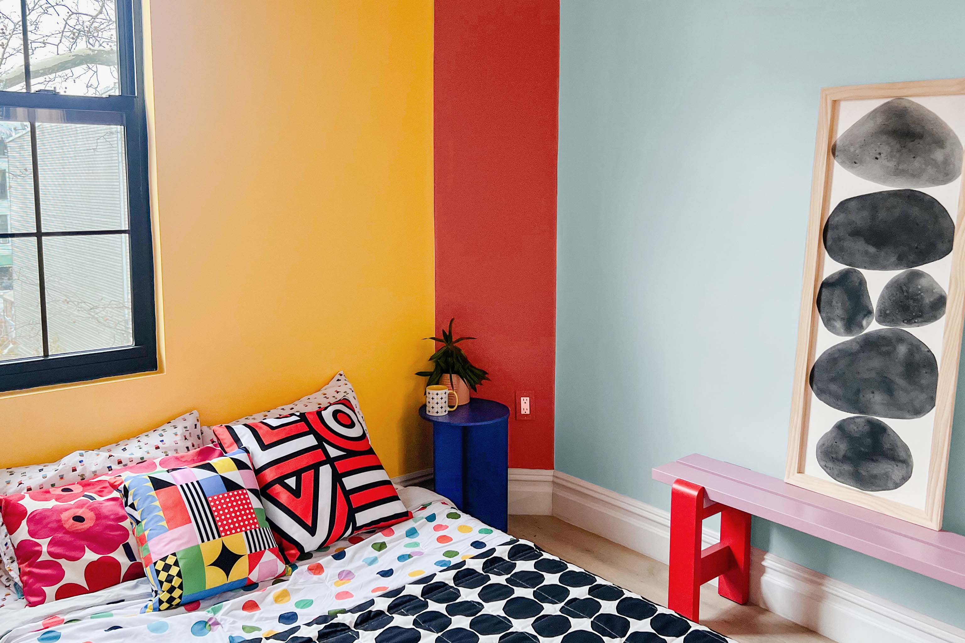Colorful bedroom idea featuring Clare colors Golden Hour, Sriracha and Frozen. See how Clare Collective ambassador Lauren Hom pulled it off on the blog.
