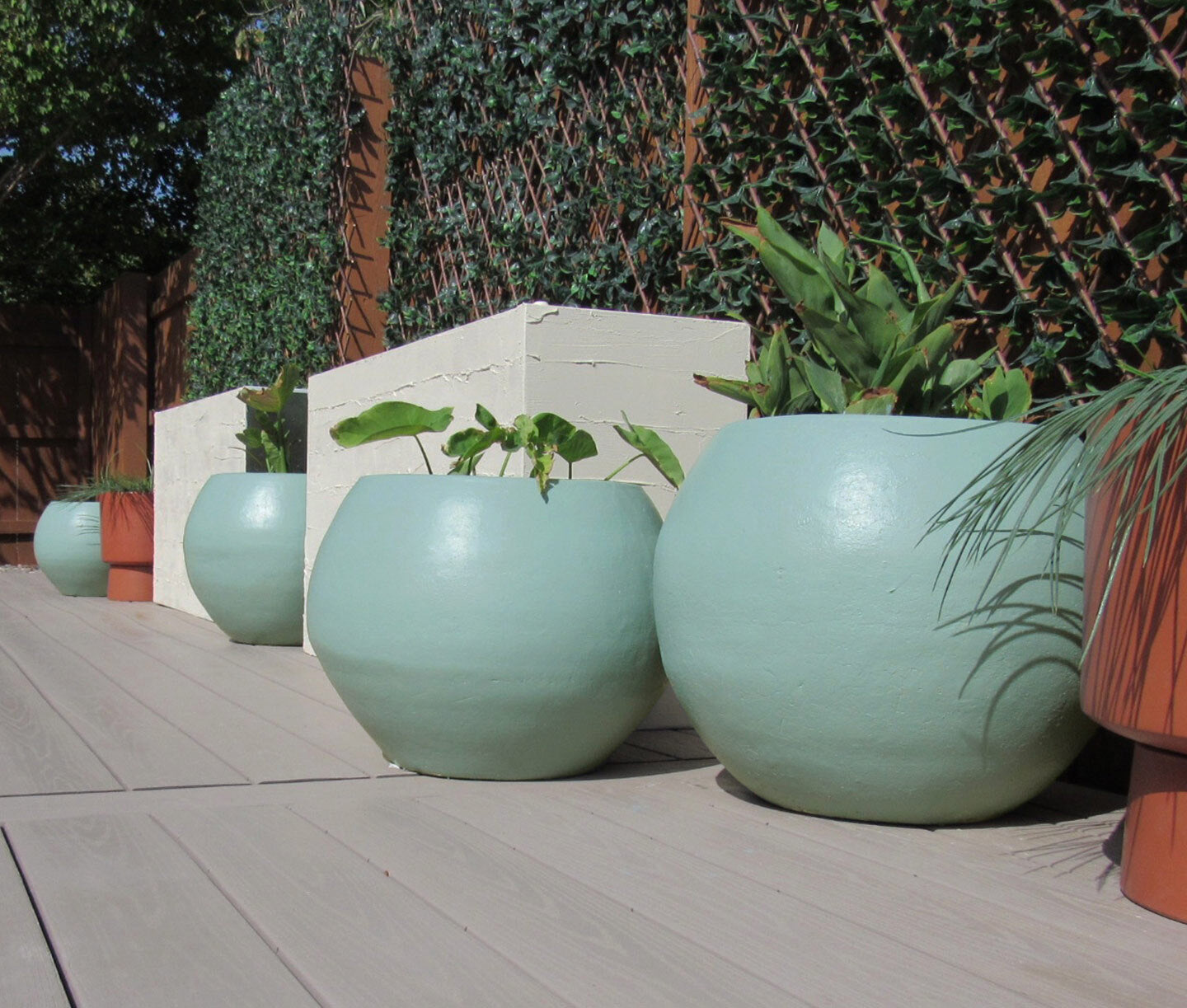 We’ve got tons of exterior paint ideas: add color to outdoor accents like pots, planters and fencing. These pots were painted with Make Waves from Clare.