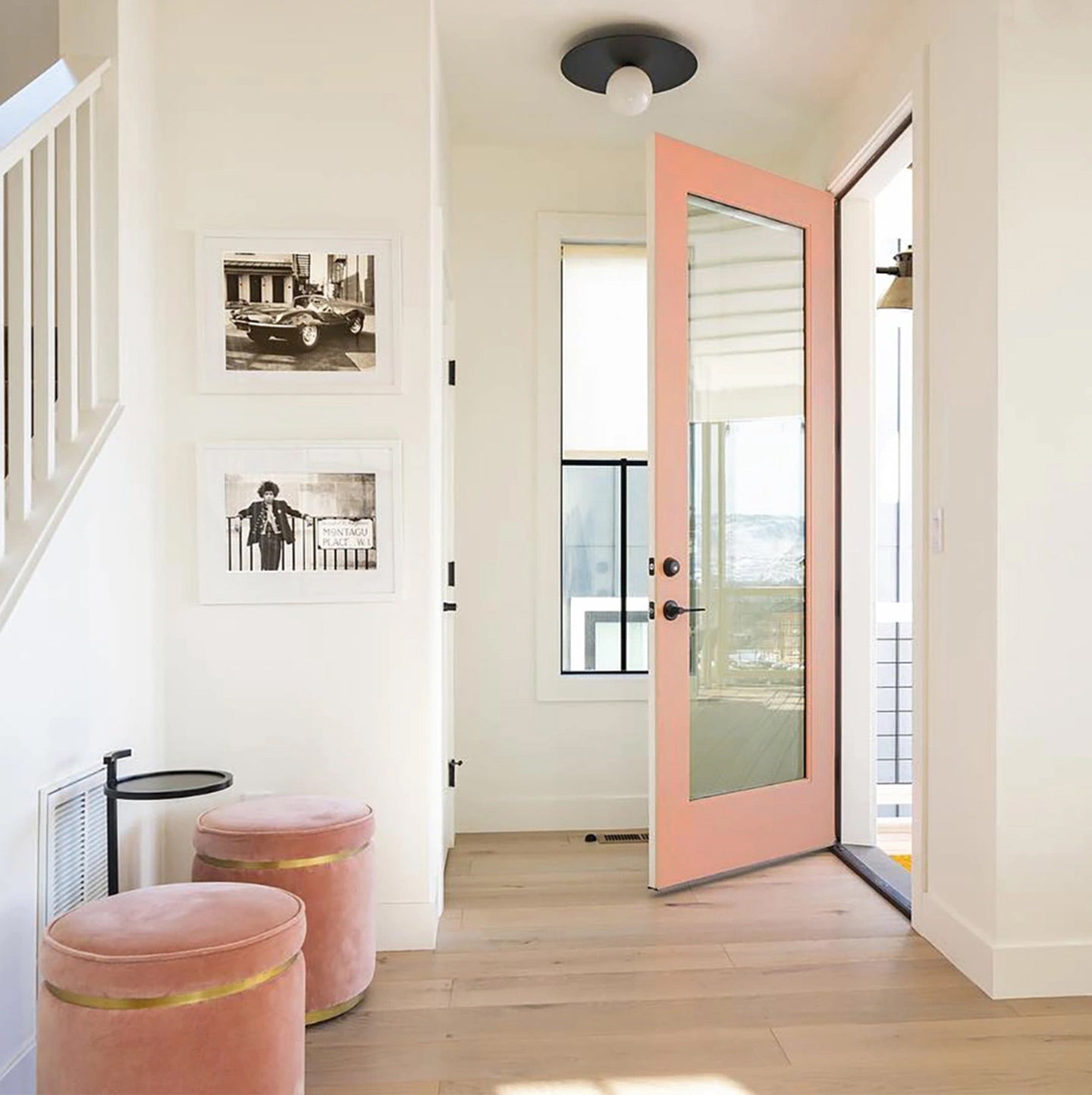 A front door painted in Pop, a playful, punchy, and coral-y hue from Clare. Painting a front door is just one of many exterior paint ideas to refresh your home.