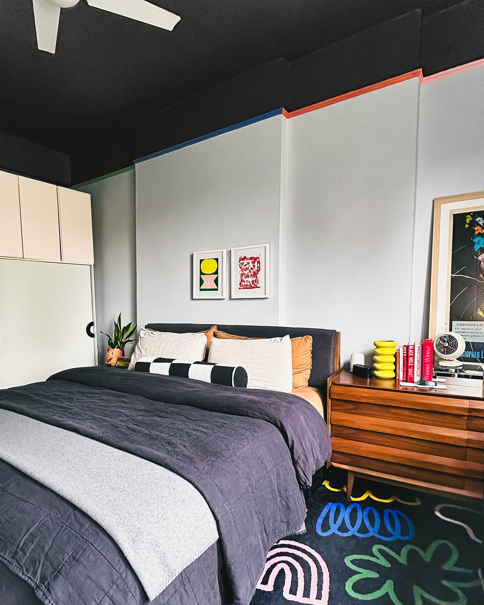 Blackish, a dark saturated black paint color from Clare, makes a statement in any room. Check out this personality-filled NYC bedroom by Clare Collective ambassador Lauren Hom.