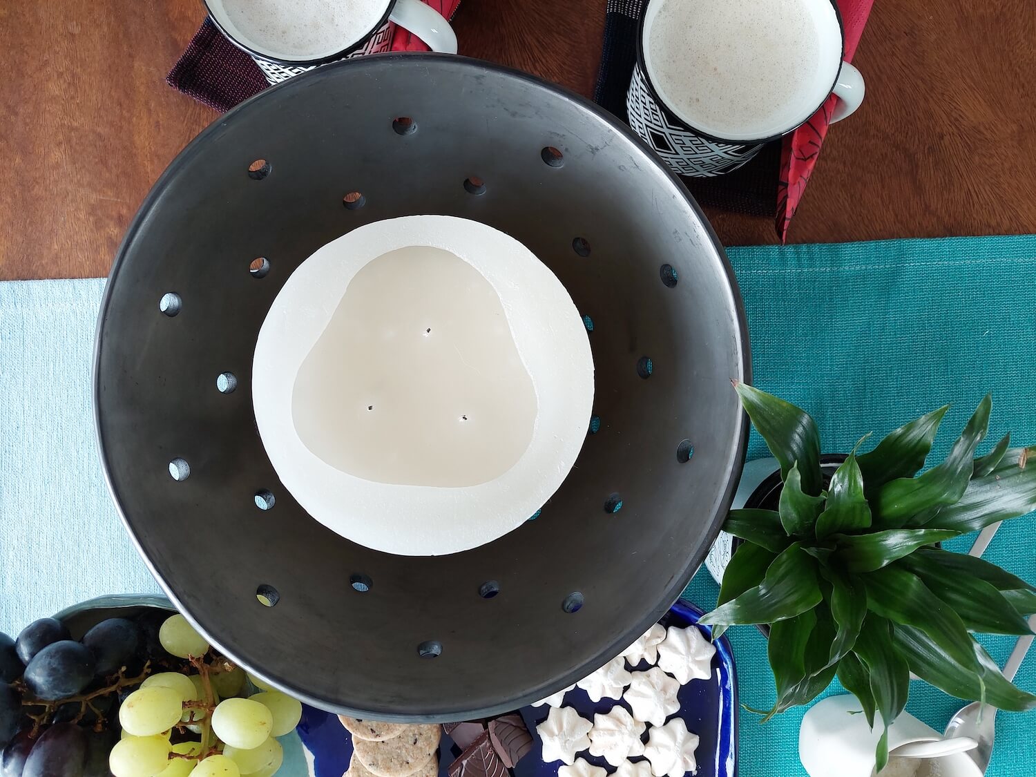 Black clay candle holder as coffee table center piece