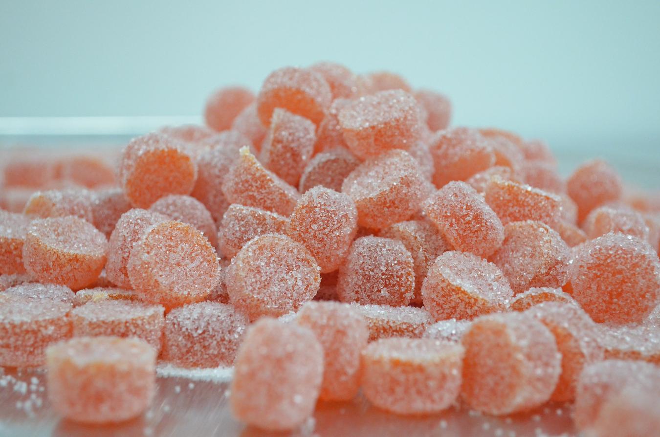 a pile of sugary red gummy candies only cbd oil organic cane sugar digestive system combining cbd oil energy drink