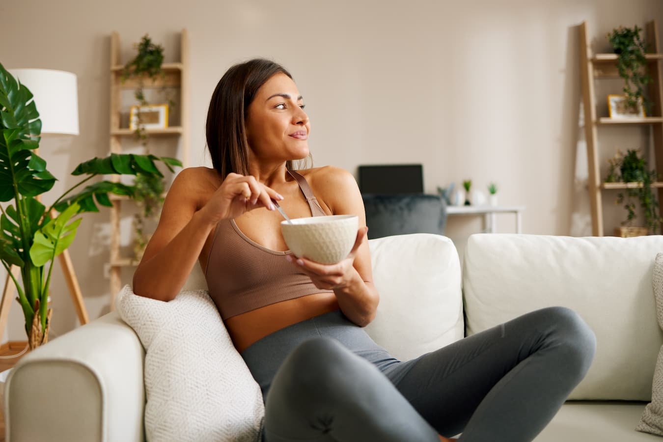 girl eating from a bowl on the couch severe anxiety site lead site browser browser