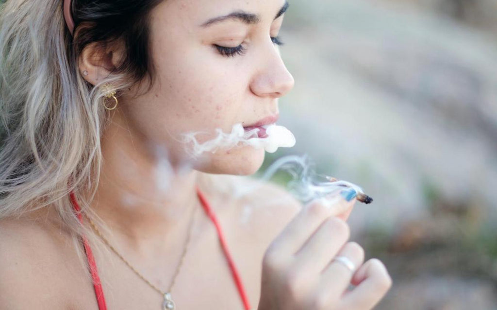 girl smoking a joint chronic pain psychoactive effects other cannabinoids health benefits stimulate appetite multiple sclerosis cannabinoids thc products anxiety