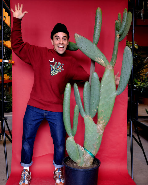 Tula co-founder Ivan Martinez stands next to a giant spineless Opuntia cactus, for sale at Tula Plants & Design.
