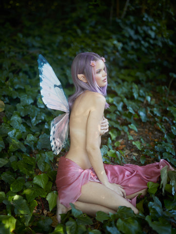A fairy in the forest wearing the strapless Rosewater Pink floating fairy butterfly wings