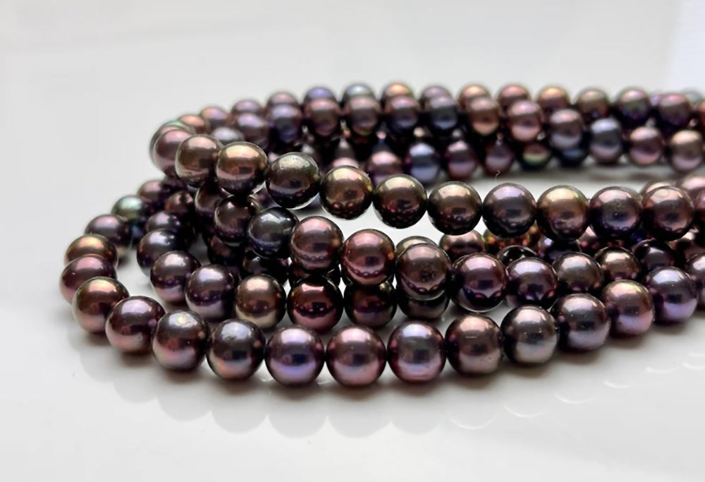 Black Freshwater Pearls Showing Copper Colors