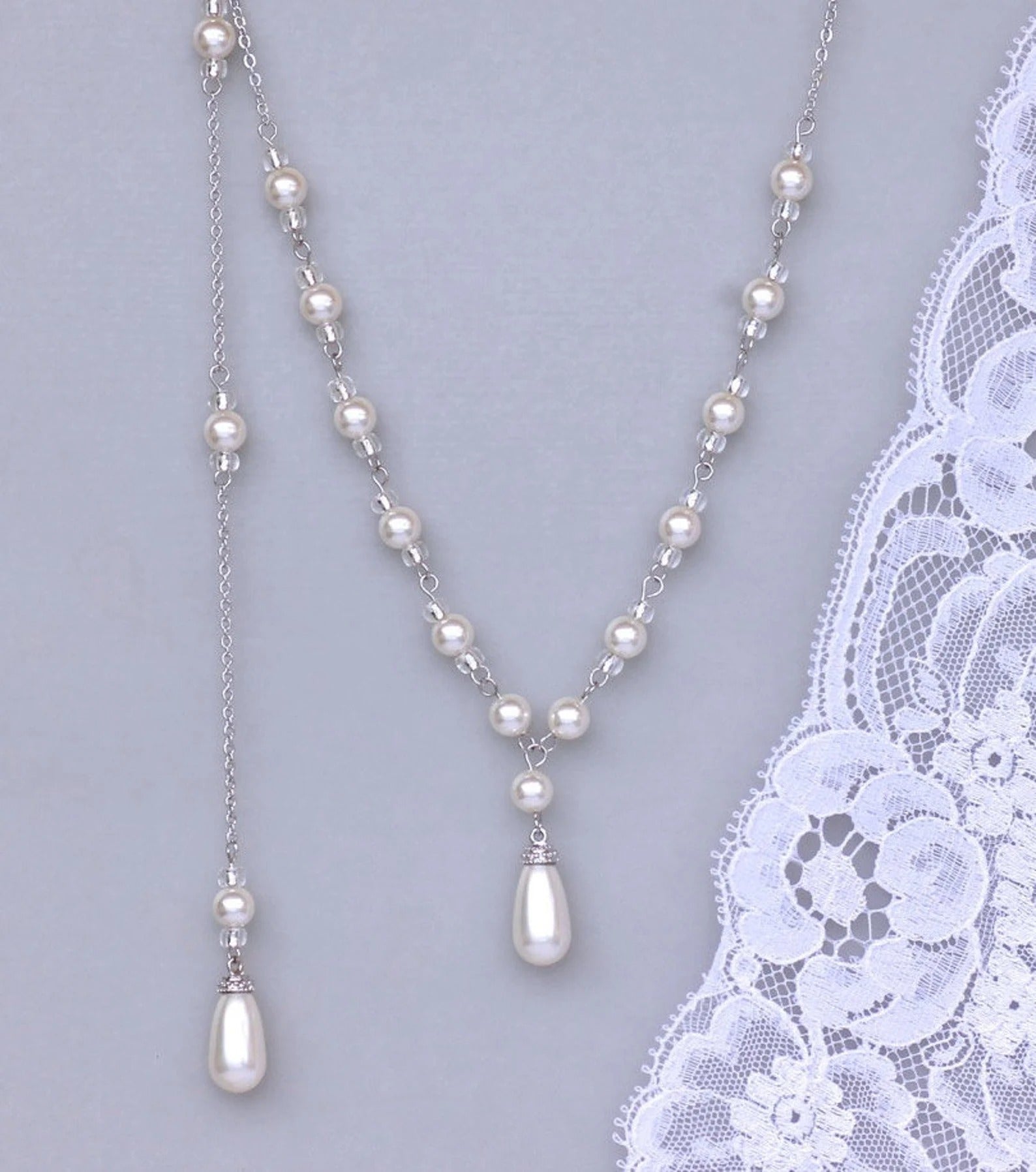 Detailed shot of romantic Vanessa Pearl Back Drop Necklace Y Necklace