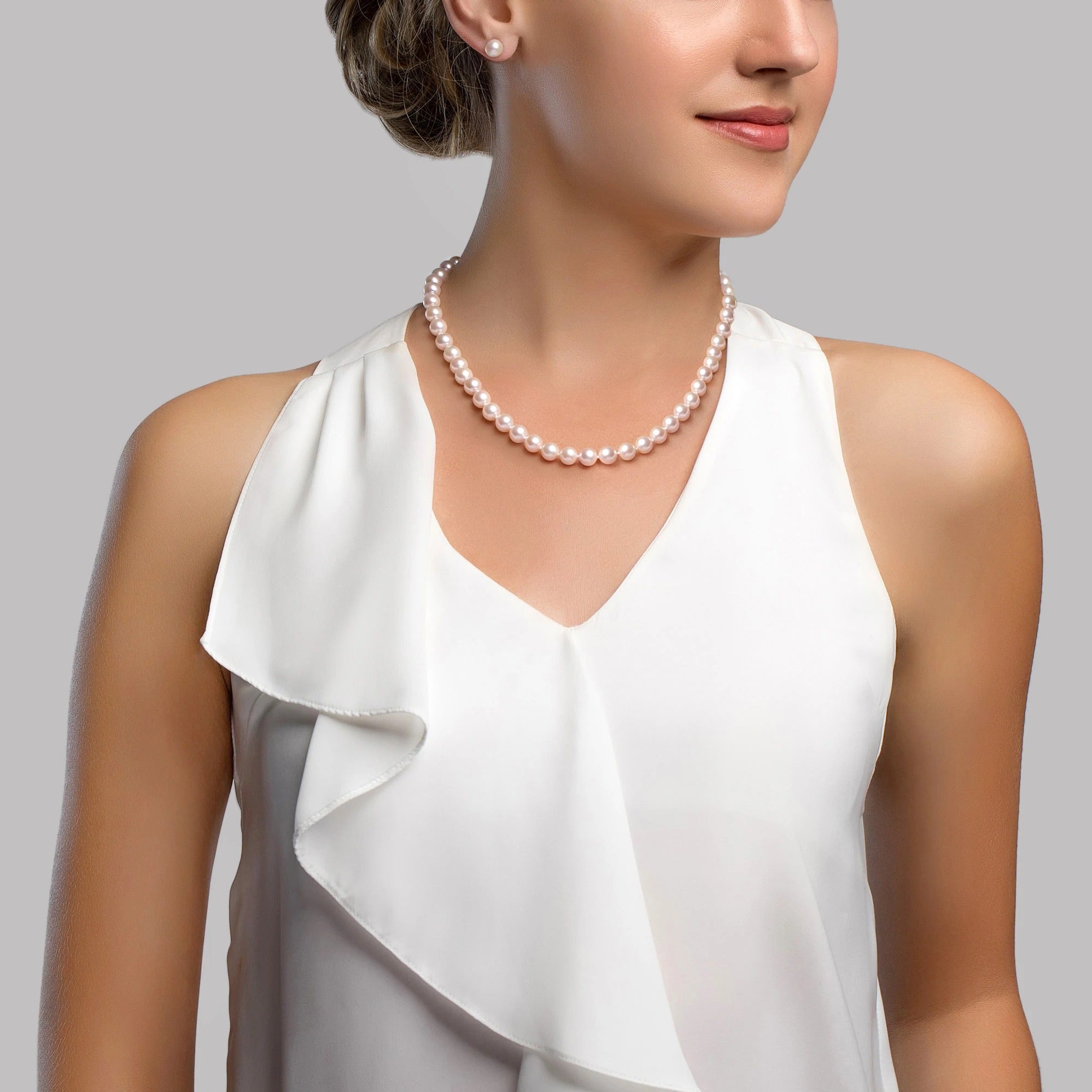 Female model wearing the 7.5-8.0mm White Japanese Akoya Pearl Necklace and Earrings Set