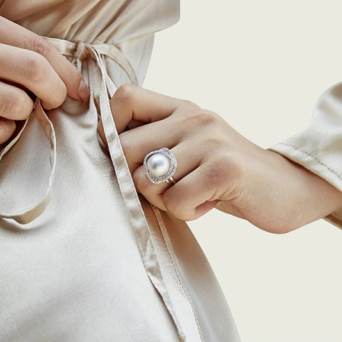 Model wearing the AAA Quality White South Sea Pearl & Diamond Orion Engagement Ring