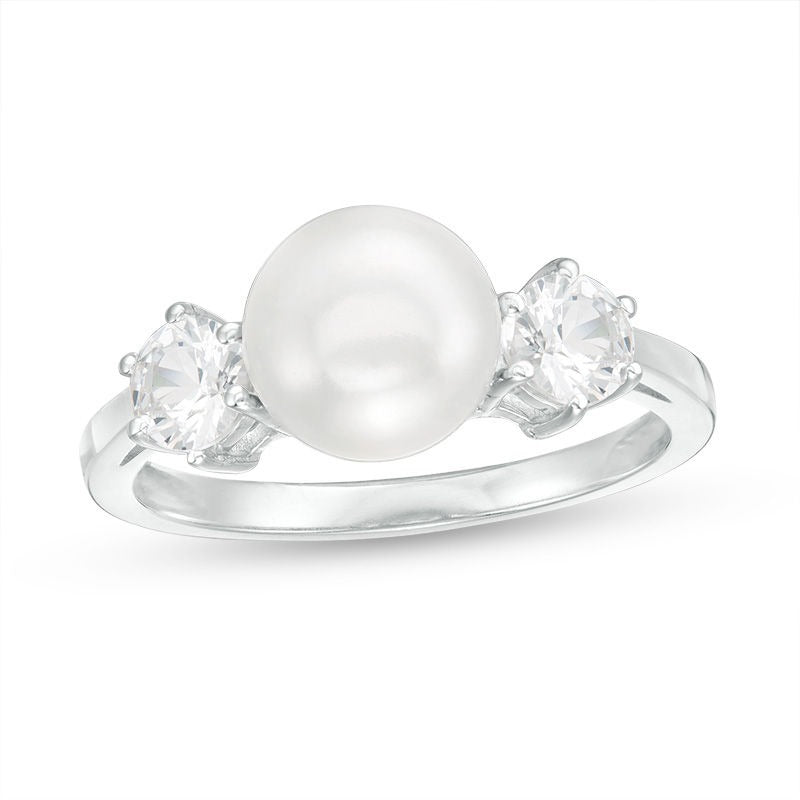 Close up shot of White Sapphire & Button Cultured Freshwater Pearl Ring
