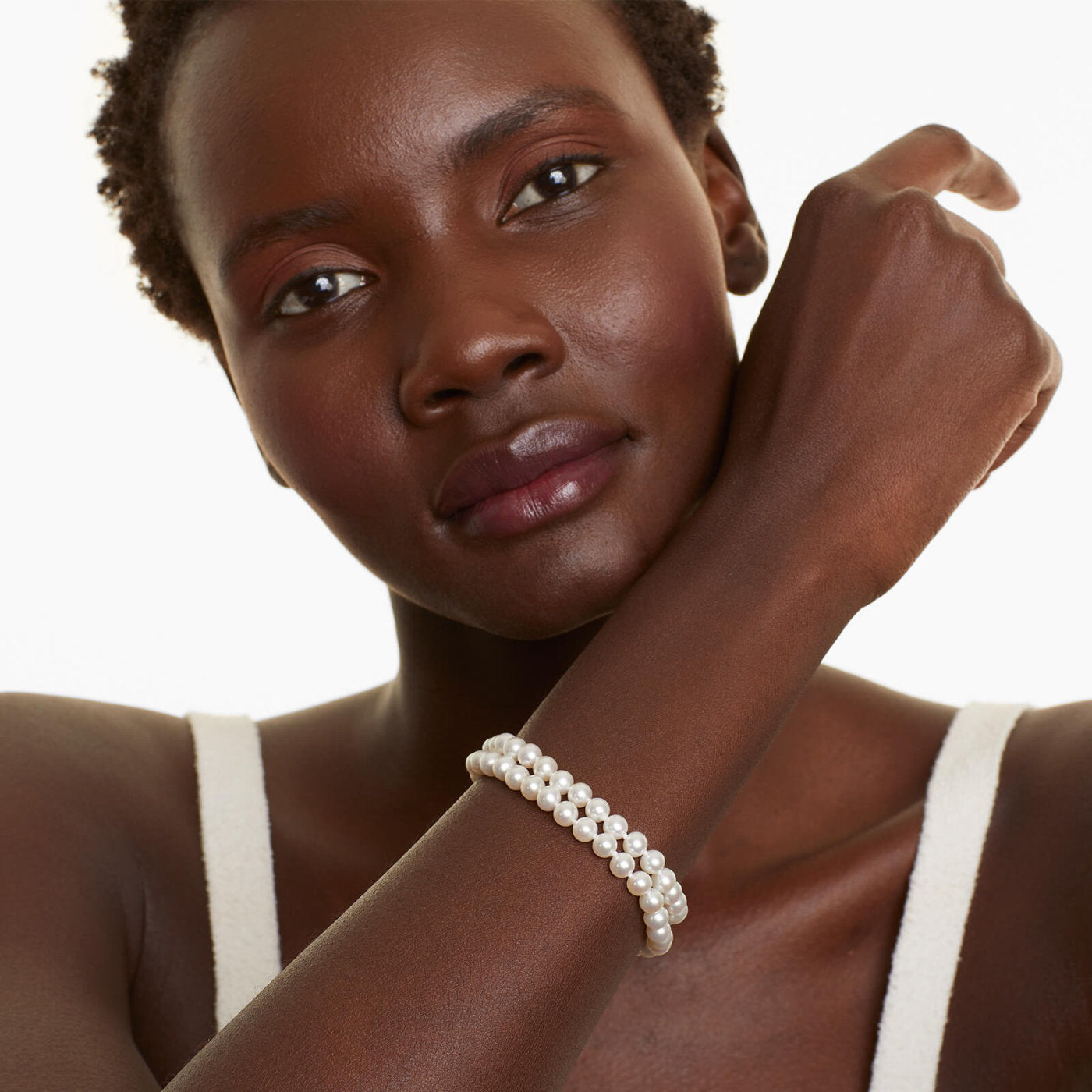 Model wearing the Freshwater Cultured Pearl Double Strand Bracelet in 14K Yellow Gold from James Allen