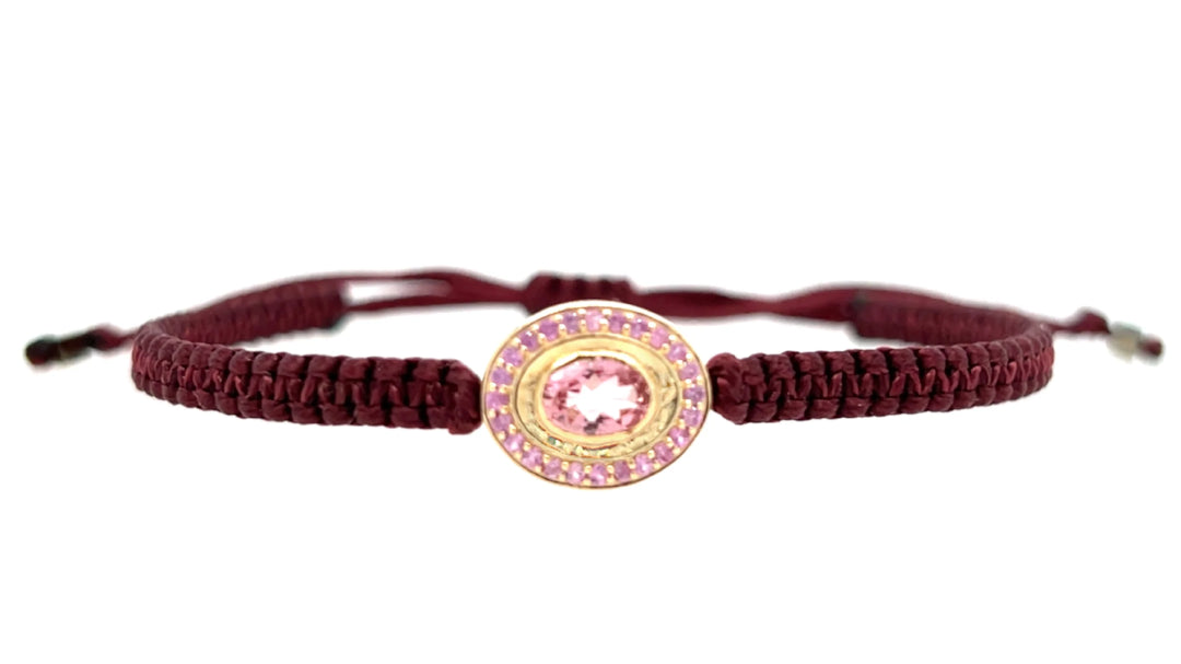 Pink tourmaline braided bracelet in 10k yellow gold.