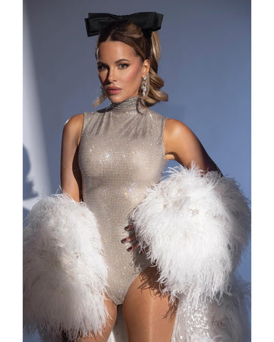 Kate Beckinsale's 50th birthday party outfit. Crystal bodysuit and feather jacket Cavanagh Baker bodysuit
