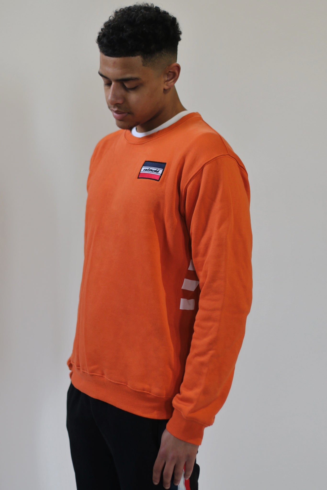 dark orange sweatshirt