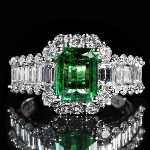 A traditional emerald and diamond dinner ring.