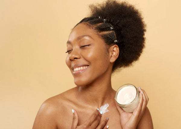 Beautiful woman holding natural hair butter